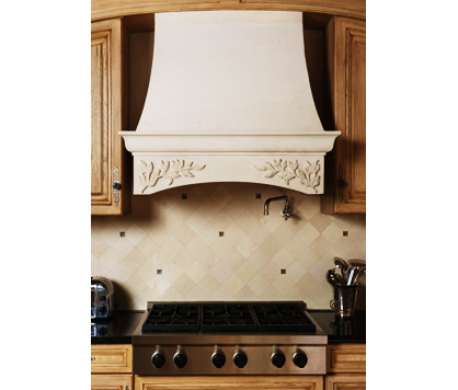 Custom hand-carved stone kitchen range hood